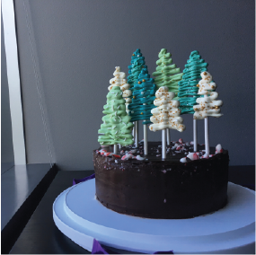 Chocolate cake with festive tree decorations